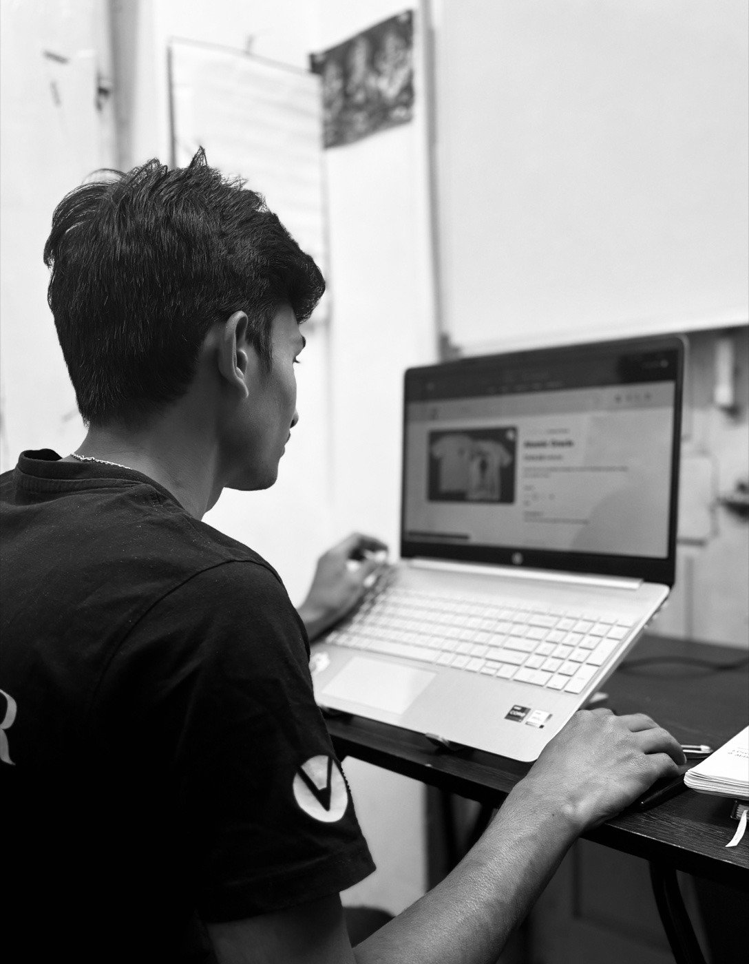 Chandan Mettu building a product on his laptop